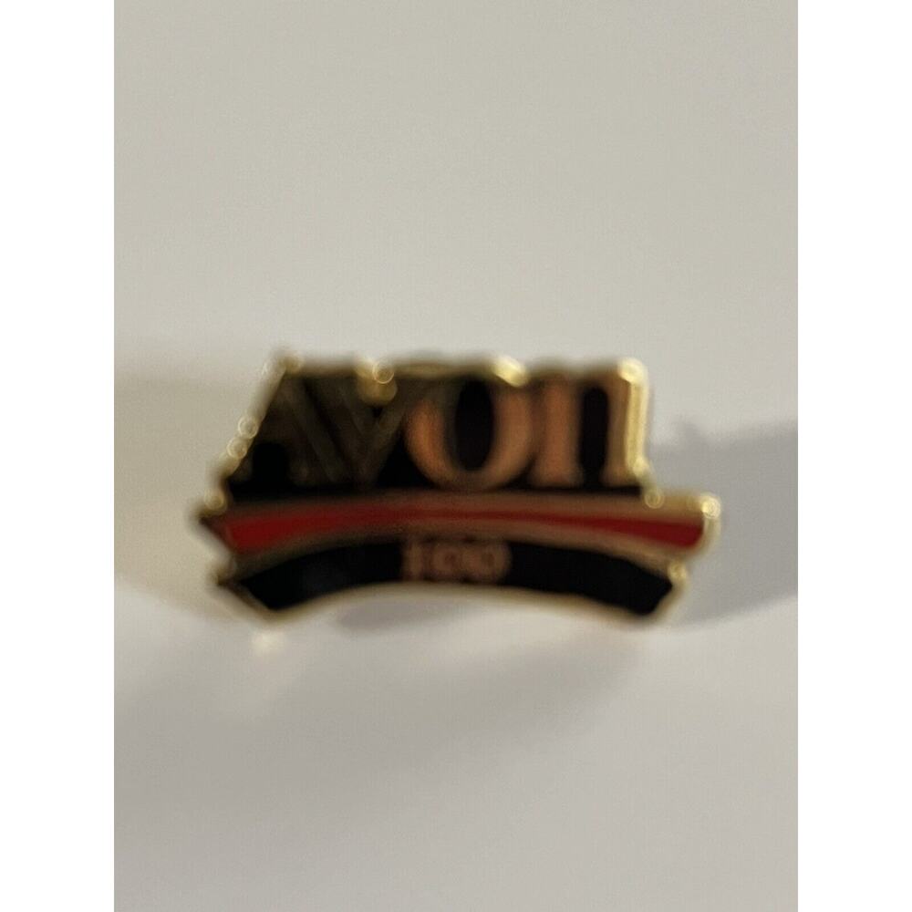 AVON 100 pin black red gold collectible